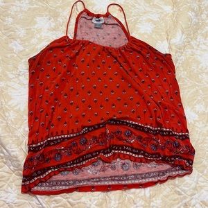 This is a red top and is great to wear to a rodeo event or a country event.